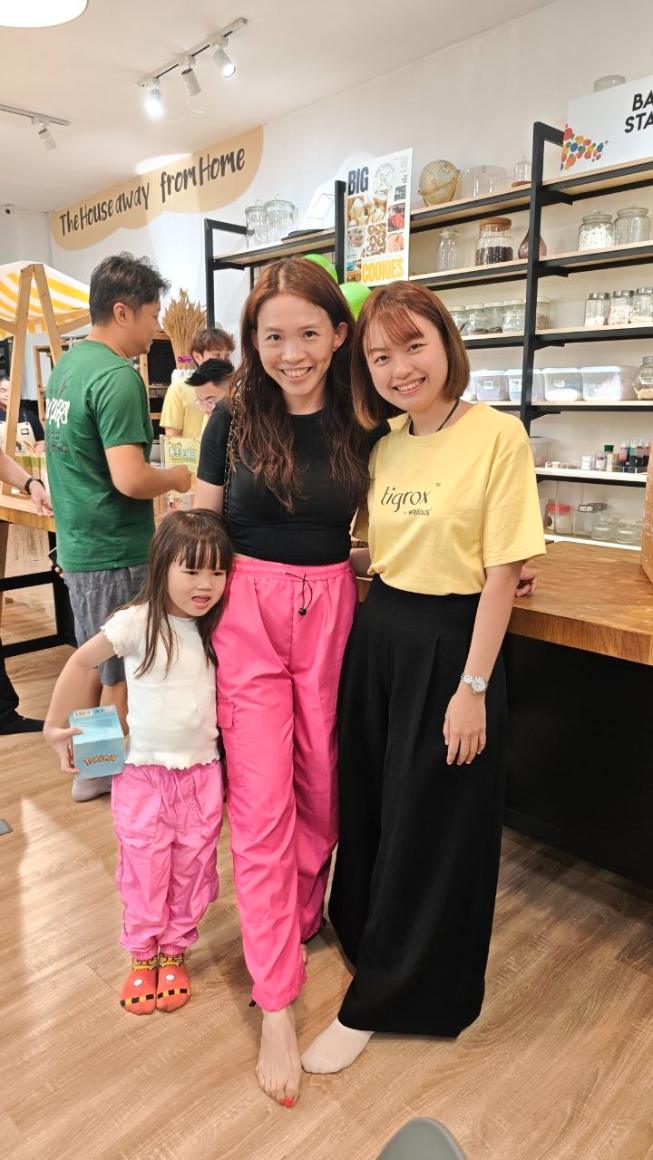 A Tigrox customer service consultant with a parent and child in store