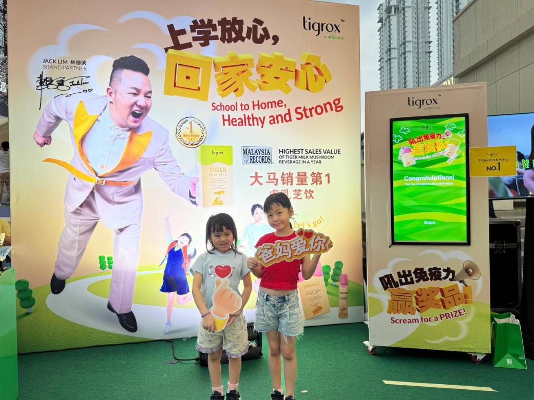 Sisters at the Tigrox roadshow backdrop