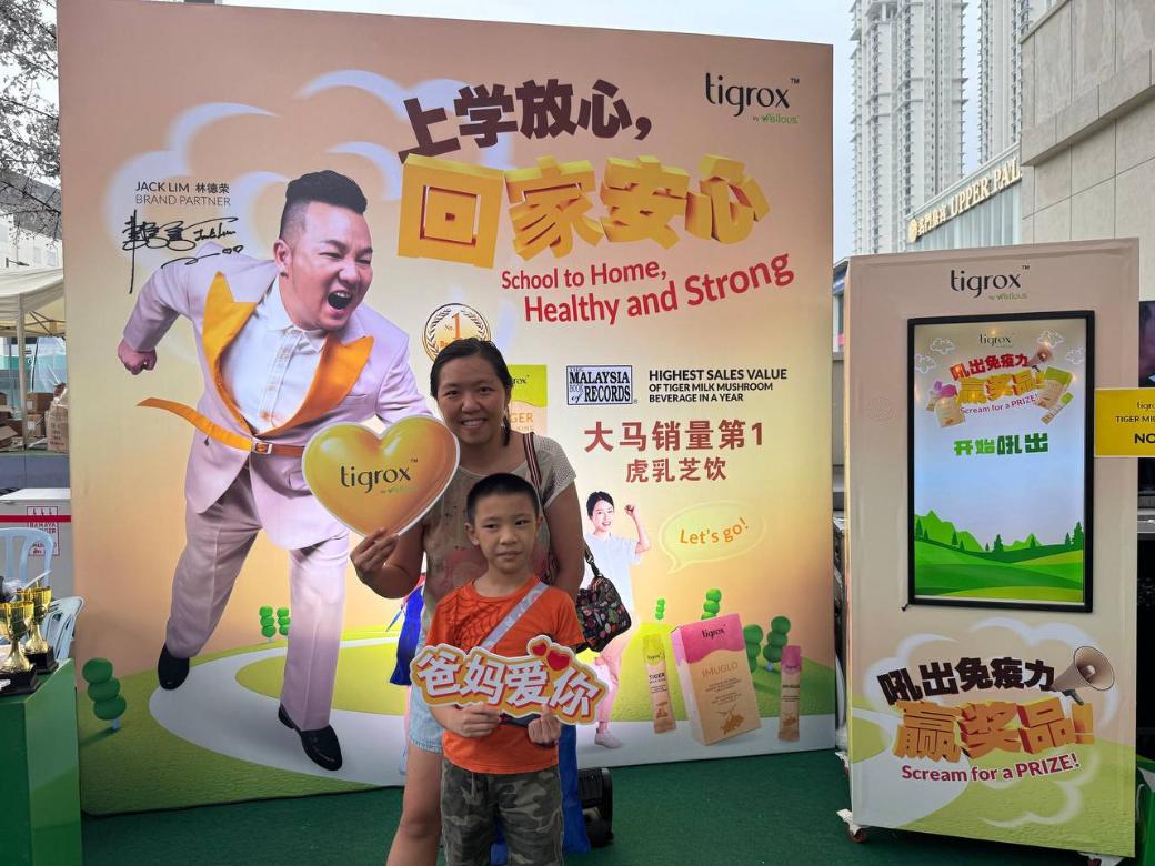 A mother and son at the Tigrox roadshow