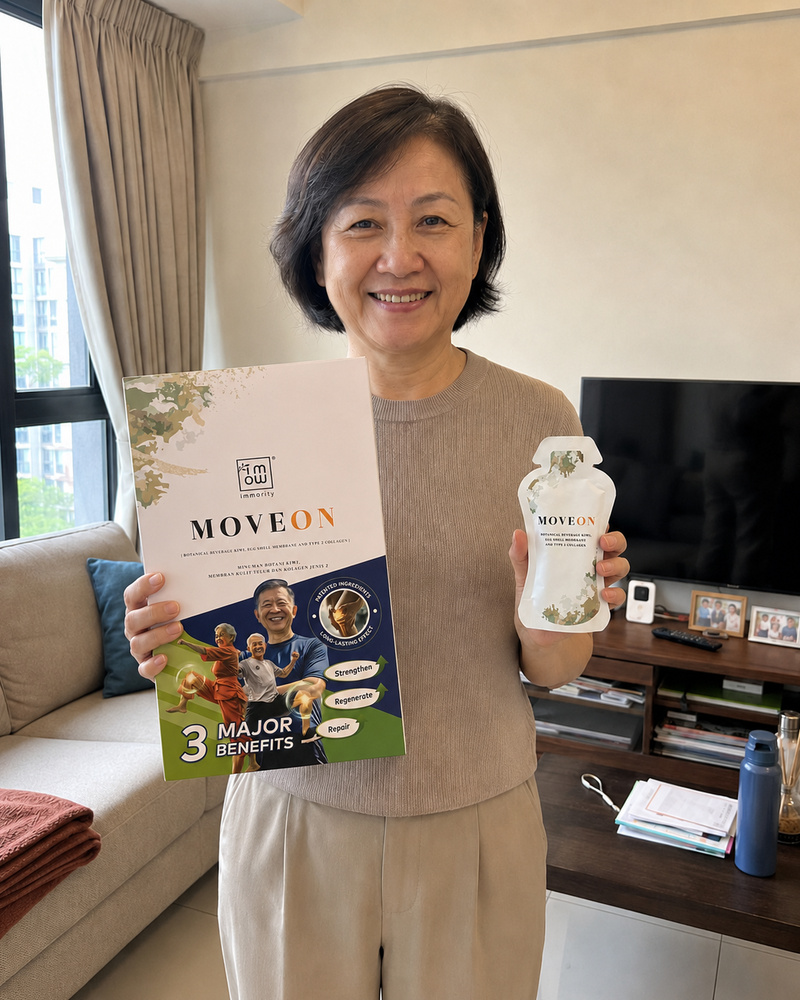Madam Tan from Melaka holding MoveOn