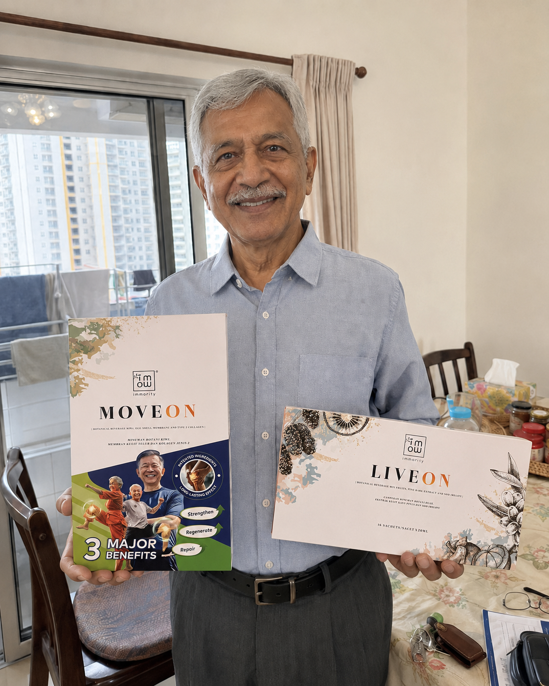 Encik Rajan from Johor Bahru holding MoveOn